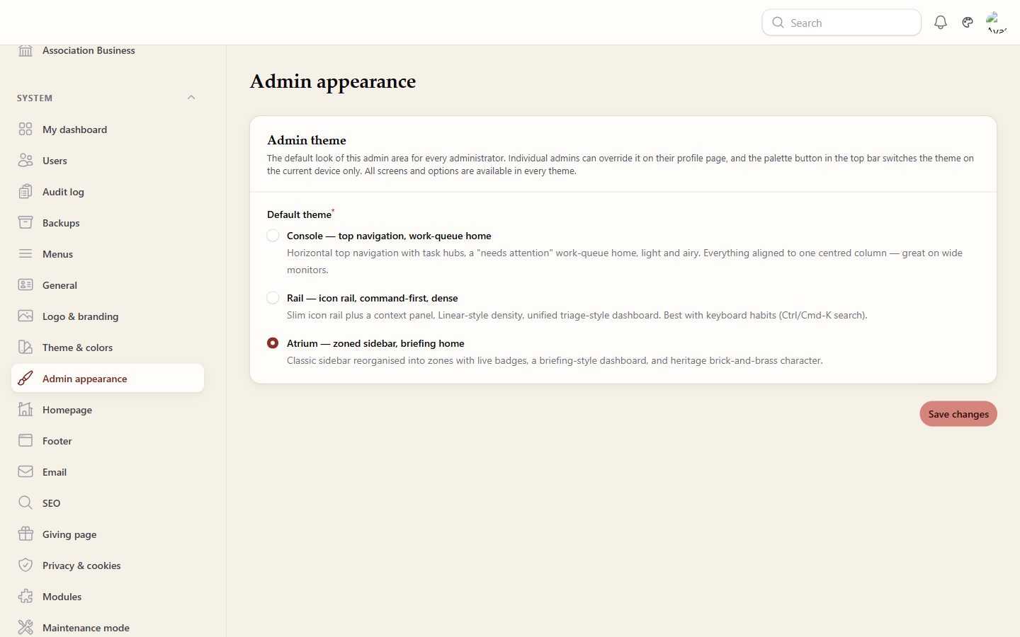 The Admin appearance settings screen. A panel headed Admin theme explains that this is the default look for every administrator, that individual admins can override it on their profile page, that the palette button in the top bar switches the theme on the current device only, and that all screens and options are available in every theme. Three radio options follow: Console, top navigation with a work-queue home; Rail, an icon rail, command-first and dense; and Atrium, a zoned sidebar with a briefing home, which is the one selected. A Save changes button sits below them.